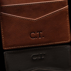 Example of embossing initials on a leather minimalist cardholder by Von Baer.
