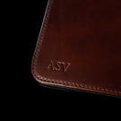 Von Baer brown leather mat featuring personalized 