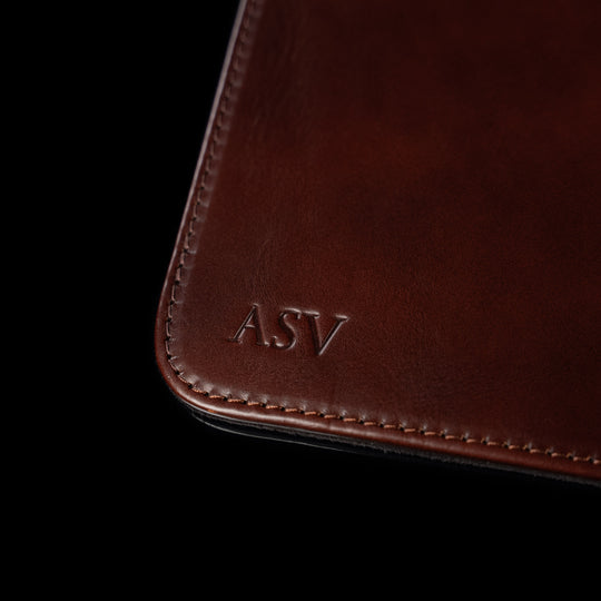 Von Baer brown leather mat featuring personalized 