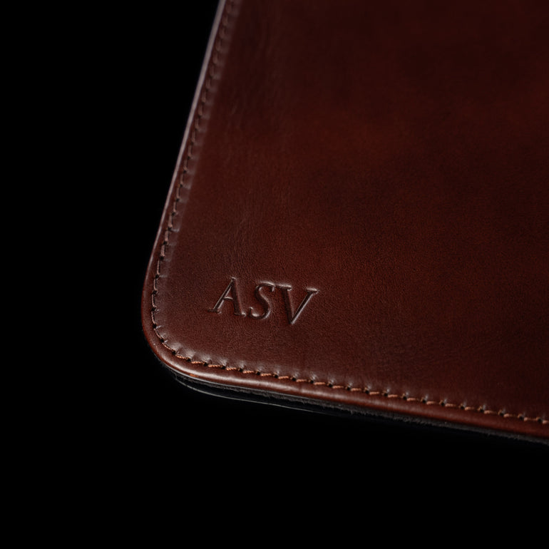 Von Baer brown leather mat featuring personalized 