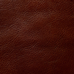Close-up of a fine-grain textured Cuoio Superiore full-grain leather, naturally structured and vegetable-tanned, highlighting the quality and organic patterns.