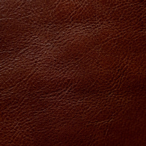 Close-up of a fine-grain textured Cuoio Superiore full-grain leather, naturally structured and vegetable-tanned, highlighting the quality and organic patterns.