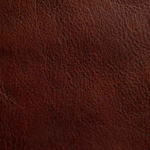 Close-up of a medium-grain textured Cuoio Superiore full-grain leather, naturally structured and vegetable-tanned, highlighting the quality and organic patterns.