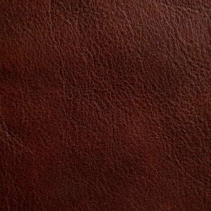 Close-up of a medium-grain textured Cuoio Superiore full-grain leather, naturally structured and vegetable-tanned, highlighting the quality and organic patterns.