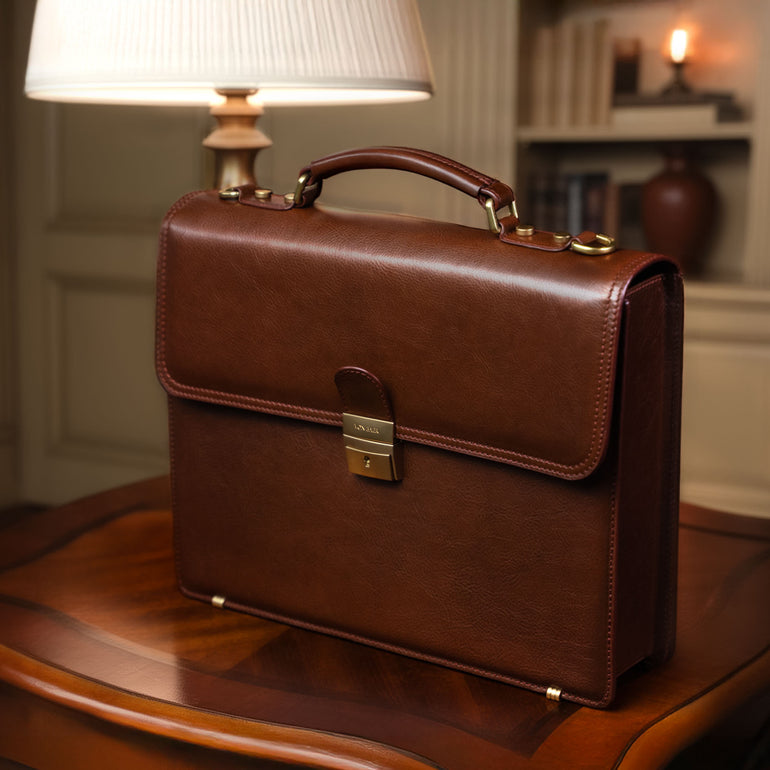 Von Baer diplomat luxurious compact full-grain leather briefcase for men in a classic luxury office with vintage lamp interior.
