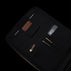 Von Baer 10x leather laptop travel backpack for men, MacBook compartment and pockets inside, filled with pens and iPhone.