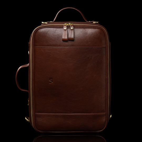 High-quality brown leather laptop travel bag for men, convertible to a backpack with a back view, made by Von Baer.