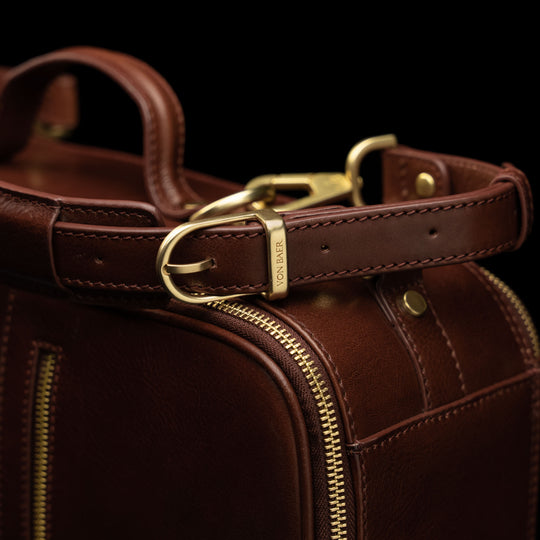 High-quality brown leather laptop travel bag for men with adjustable straps, made by Von Baer.