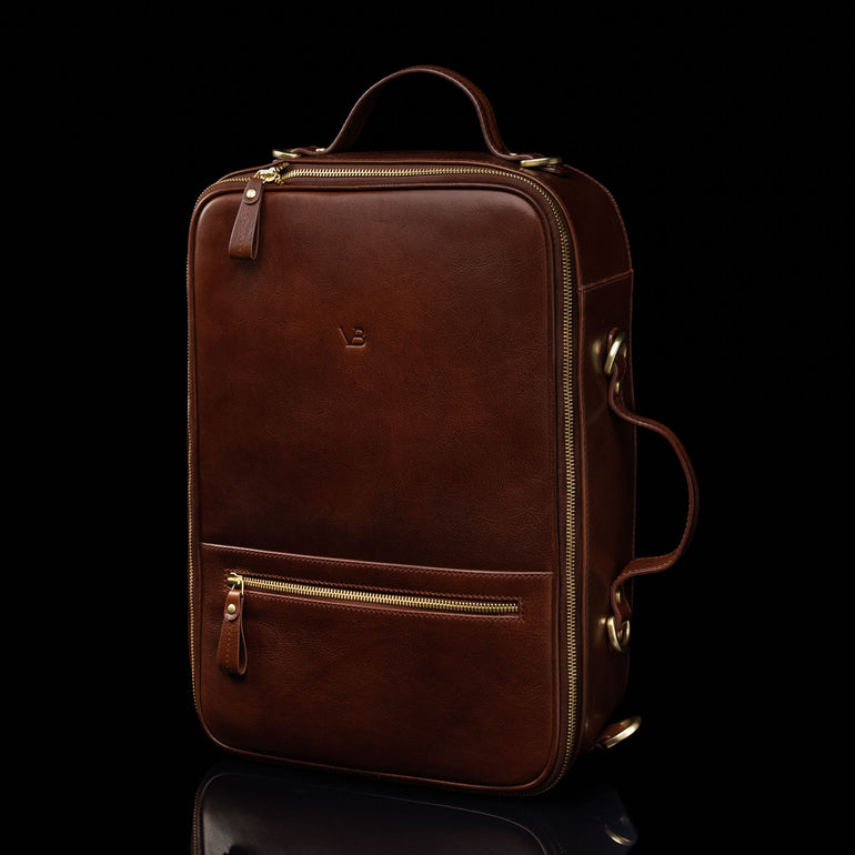 The Von Baer 10x men's high-quality leather laptop travel bag in brown, half-turned view, showcasing its sleek design, adjustable straps, and spacious compartments for convenient and stylish travel.