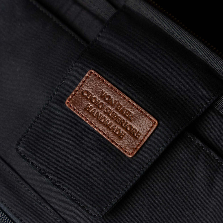 The Von Baer 10x men's high-quality leather laptop travel bag, featuring a Cuoio Superiore handmade design with a dedicated laptop compartment, offering both elegance and functionality for business travelers.