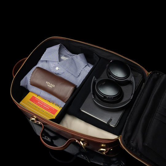 Von Baer 10x spacious leather laptop travel bag, packed with a suit and items.