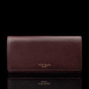 Von Baer Allure large burgundy full-grain leather accordion wallet with RFID protection and gold-tone branding, shown in a front view against a black background.