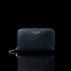 Von Baer Celeste small navy blue full-grain leather zip-around wallet with gold-tone branding, displayed in a front view against a black background.