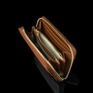Von Baer Celeste small tan full-grain leather zip-around wallet with RFID protection, shown in an upper view highlighting the organized interior center coin compartment and gold-embossed Von Baer Tallinn branding.