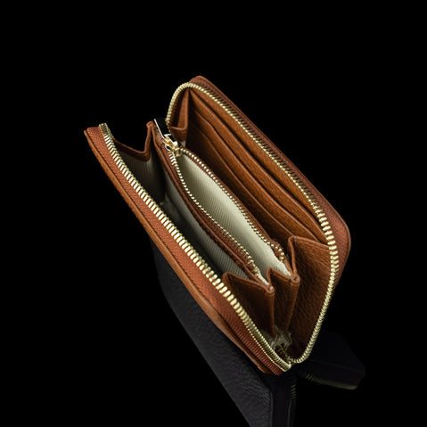 Von Baer Celeste small tan full-grain leather zip-around wallet with RFID protection, shown in an upper view highlighting the organized interior center coin compartment and gold-embossed Von Baer Tallinn branding.
