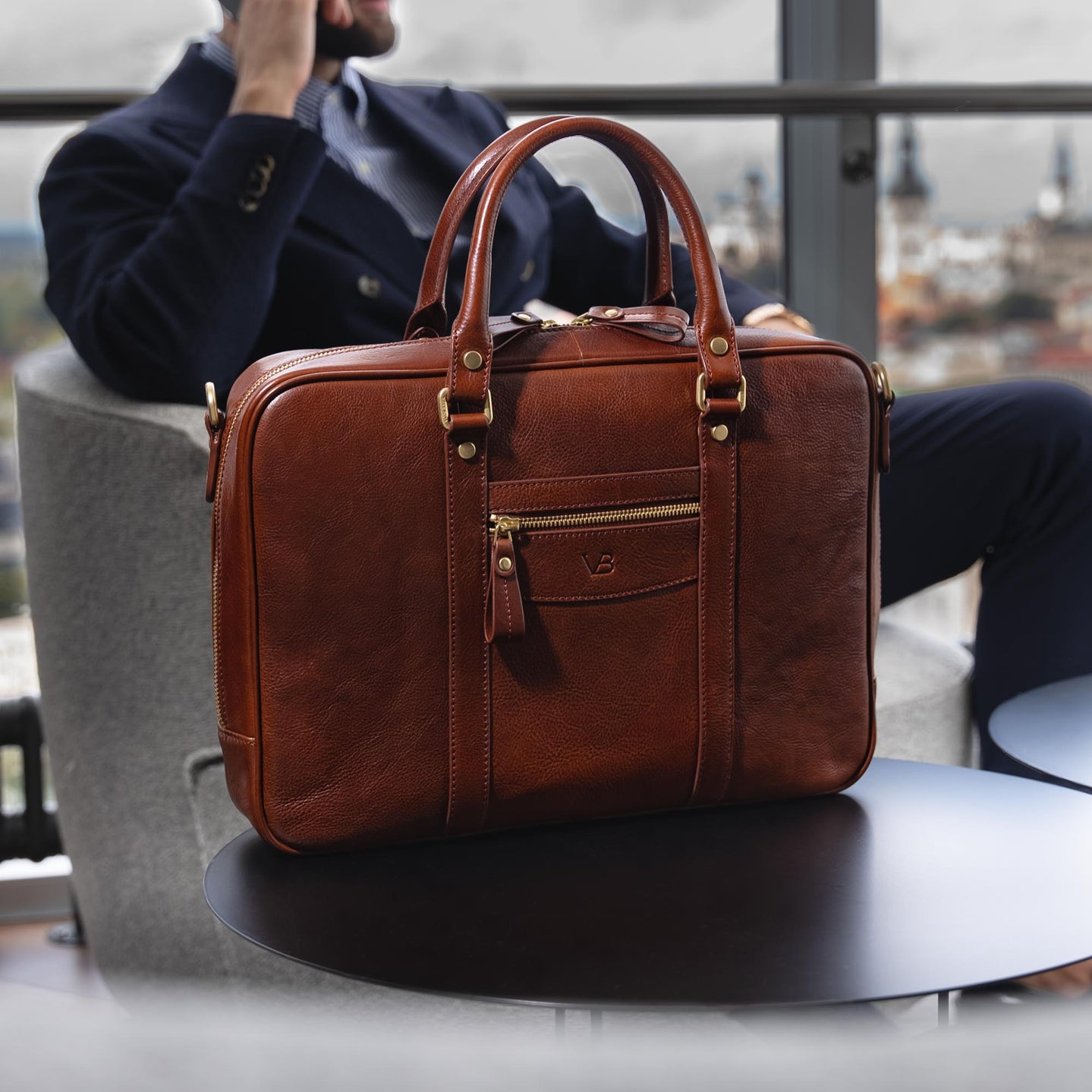 Von Baer City Business brown leather laptop bag with male model and scenic background view