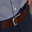 Von Baer classic luxury full-grain leather belt for men in brown, with a silver stainless steel buckle, upper view.
