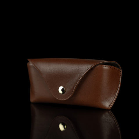 A half-turned view of a brown Von Baer Deluxe luxury leather glasses case.