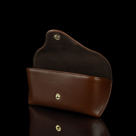 A brown Von Baer Deluxe luxury leather glasses and sunglasses case, shown open and half-turned.