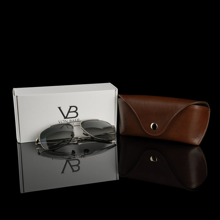 A brown Von Baer Deluxe luxury leather glasses and sunglasses case for women, with a gift box and glasses.