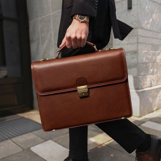 Luxurious premium full-grain leather briefcase by von baer for men in a business city lifestyle setting.