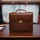 Luxurious premium full-grain leather briefcase for men in a luxury office by Von Baer.