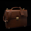 Compact full-grain leather laptop briefcase with shoulder strap and luggage tag for professional work, brown perspective view by Von Baer diplomat.