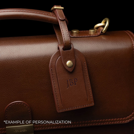 Von Baer diplomat men’s compact full-grain leather briefcase luggage tag close-up with personalized embossed initials.