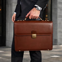 Von Baer diplomat men’s classic compact full-grain leather briefcase in brown, city setting for businessman and professional work.