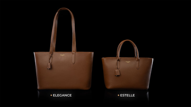 Von Baer Elegance and Estelle women's full-grain cognac leather tote bags displayed side by side on a black background to compare sizes, showing the larger Elegance bag alongside the smaller Estelle bag.