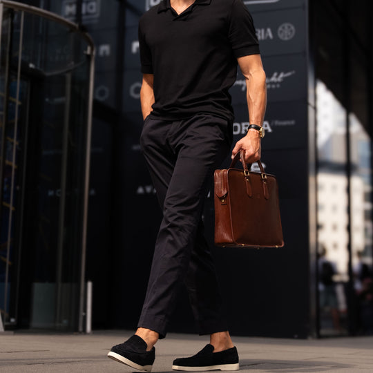 Handsome man holding the brown Von Baer Elegant slim leather laptop bag, showcasing fashion and style