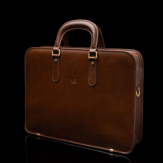 Von Baer Elegant high-quality slim full-grain leather laptop bag in brown, half-turned, for women.