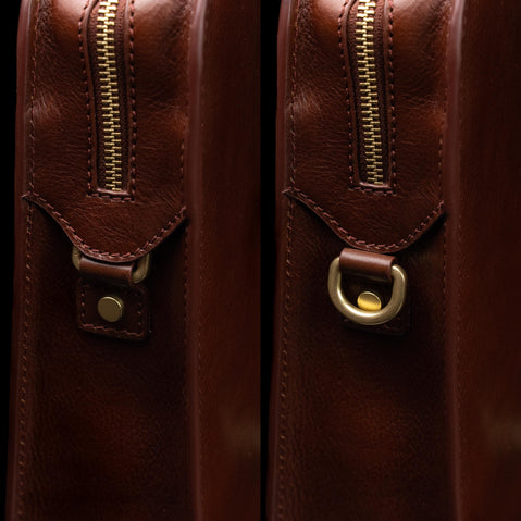 Von Baer Elegant high-quality slim full-grain leather women’s laptop bag in brown, half-turned side view with brass rings.