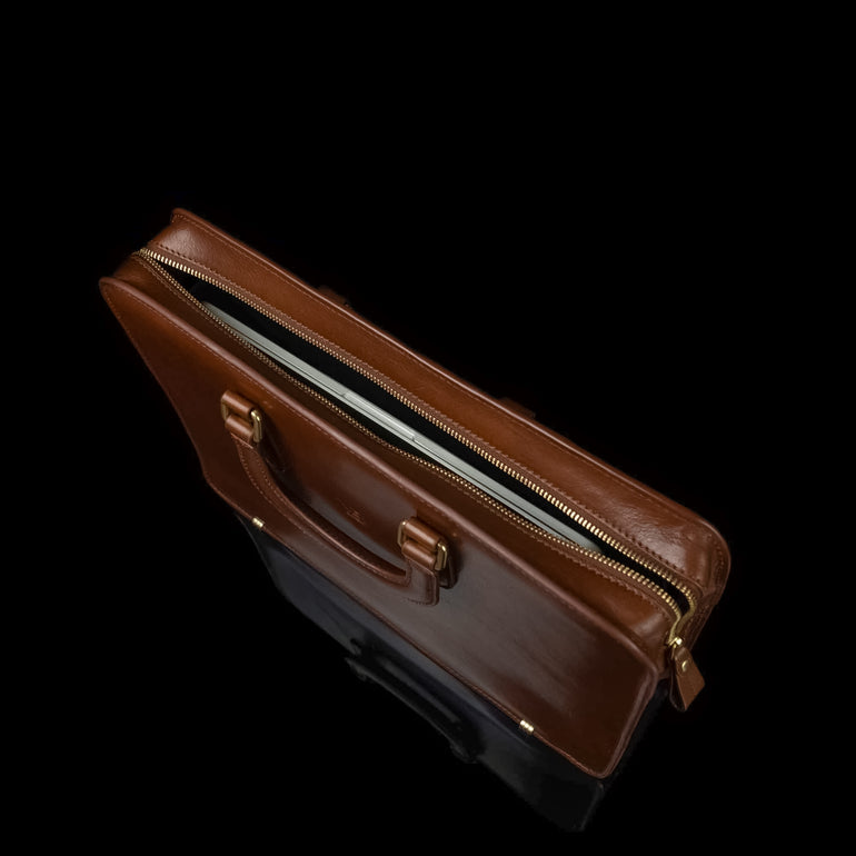 Men’s Von Baer Elegant high-quality slim full-grain leather laptop bag in brown, showcasing a MacBook inside.