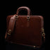 Von Baer Elegant high-quality slim full-grain leather women’s laptop bag in brown, with an adjustable shoulder strap.