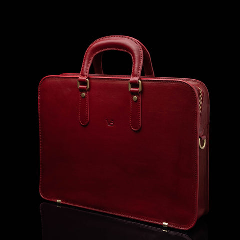 Von Baer Elegant high-quality slim full-grain leather laptop bag for women in red, half-turned.