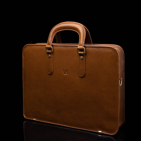 Von Baer Elegant high-quality slim full-grain leather laptop bag for women in tan, half-turned.