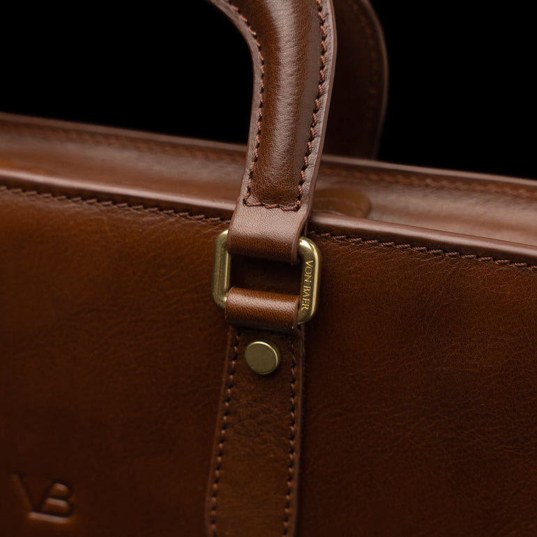 Men’s Von Baer Elegant high-quality slim full-grain leather laptop bag in brown, featuring solid brass hardware.