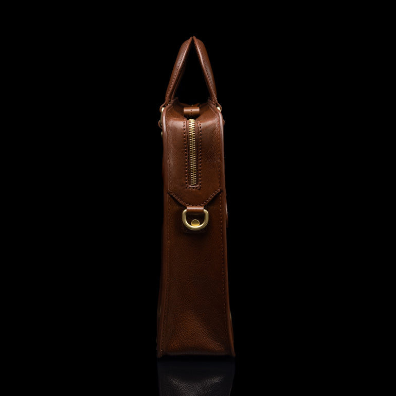 Von Baer Elegant high-quality slim full-grain leather women’s laptop bag in brown, side view.