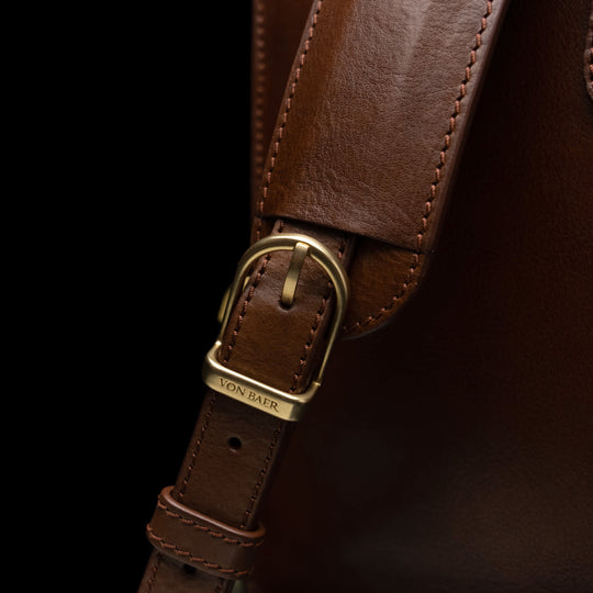 Von Baer Elegant high-quality slim full-grain leather women’s laptop bag in brown, featuring solid brass hardware.