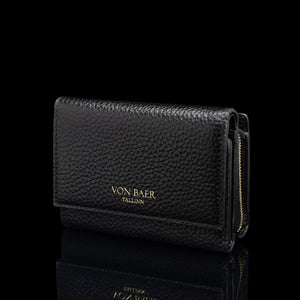 Von Baer Elise women's black pebbled leather trifold wallet shown from a three-quarter front view on a reflective black background, featuring gold-embossed Von Baer Tallinn branding and a gold zipper.
