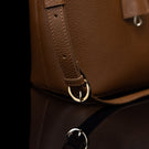 Von Baer Estelle brown leather crossbody tote bag for women, close-up of the adjustable shoulder strap with buckle and polished gold-tone hardware.