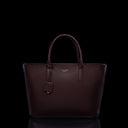 Von Baer Estelle burgundy small leather tote bag for women, shown from the front with structured top handles, pebbled leather texture, hanging clochette and gold-tone logo.