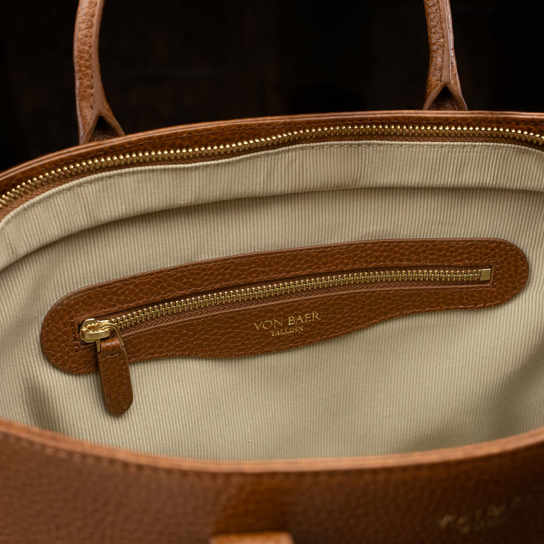Von Baer Estelle brown small leather tote bag for women, showing the cream-lined interior with a leather-trimmed zipped pocket and gold-tone hardware.