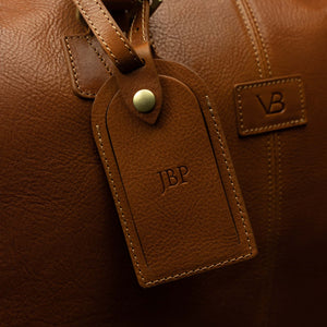 Von Baer luggage tag on Grand Travel Garment Bag with personalized embossed initials JBP