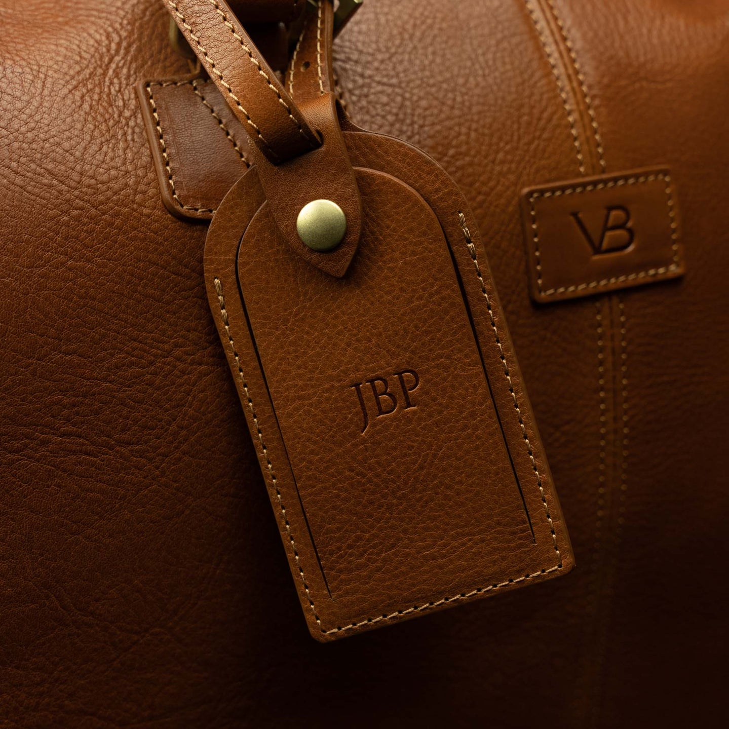 Von Baer luggage tag on Grand Travel Garment Bag with personalized embossed initials JBP