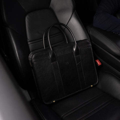 Von Baer Exquisite luxury slim full-grain leather laptop bag on seat of Porsche car
