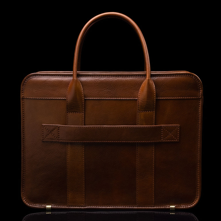Men’s Von Baer Exquisite luxury full-grain leather laptop briefcase in brown, back view of luggage strap for travel.