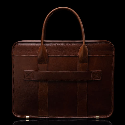 Men’s Von Baer Exquisite luxury full-grain leather laptop briefcase in brown, back view of luggage strap for travel.