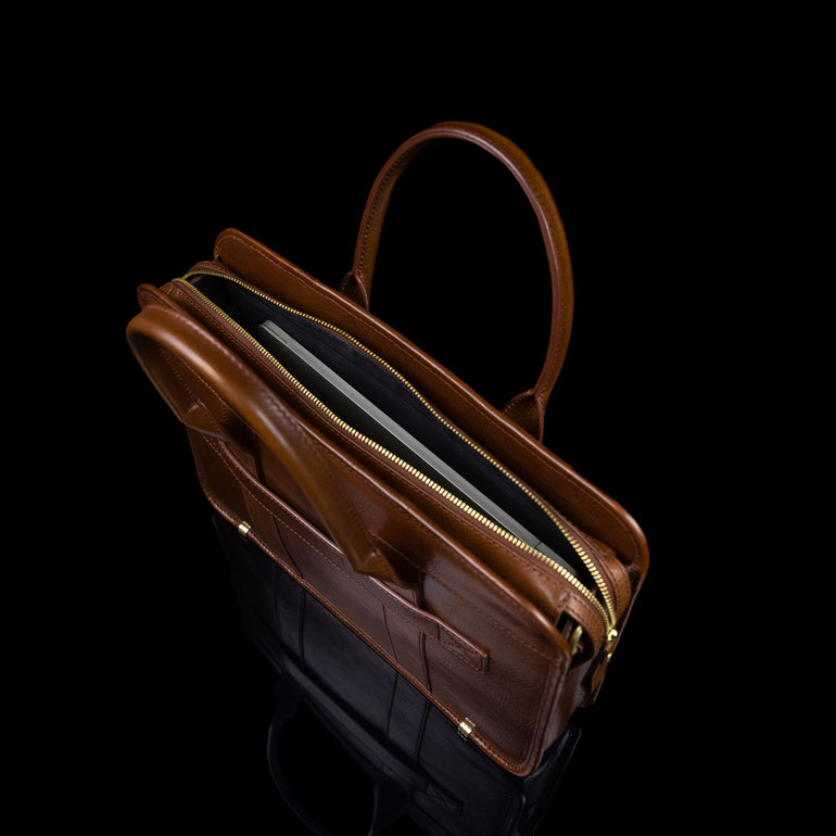Men’s Von Baer Exquisite luxury full-grain leather laptop briefcase in brown, with a MacBook inside.